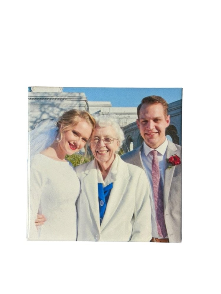 Custom photo magnet of a bride, groom, and grandmother at a wedding
