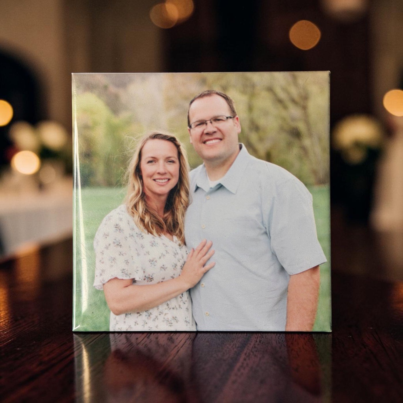 Custom photo magnet of a couple displayed on a table
