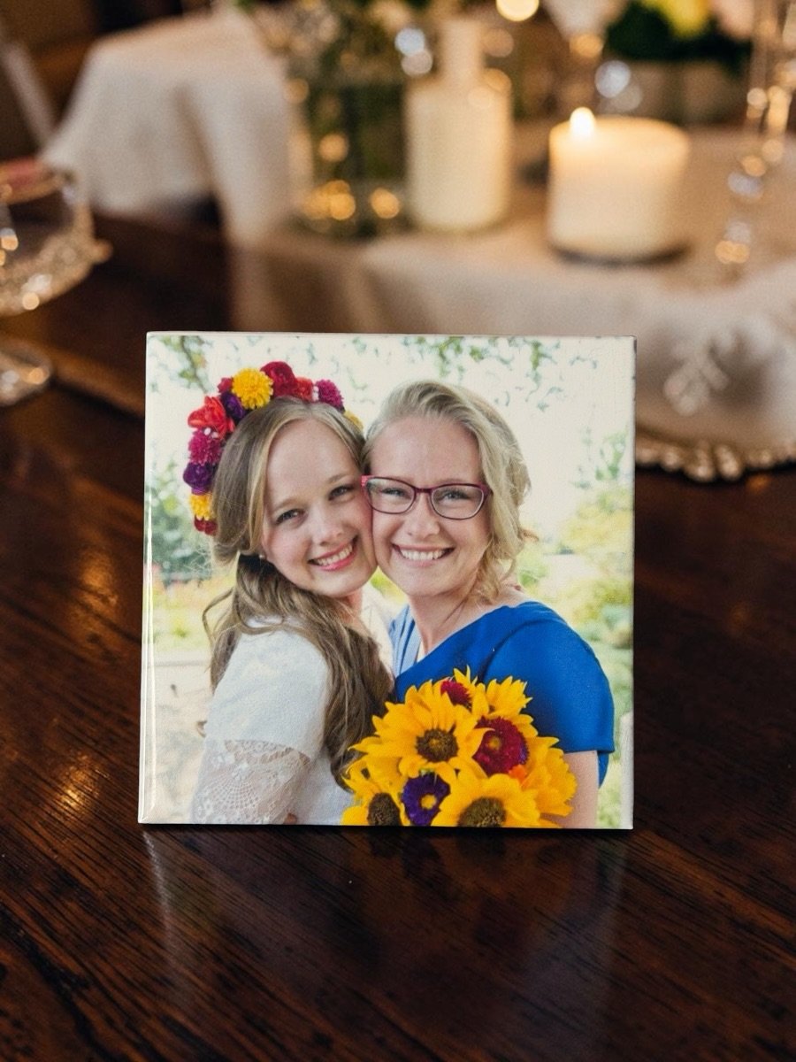 Wedding photo magnet displayed on a candlelit reception table